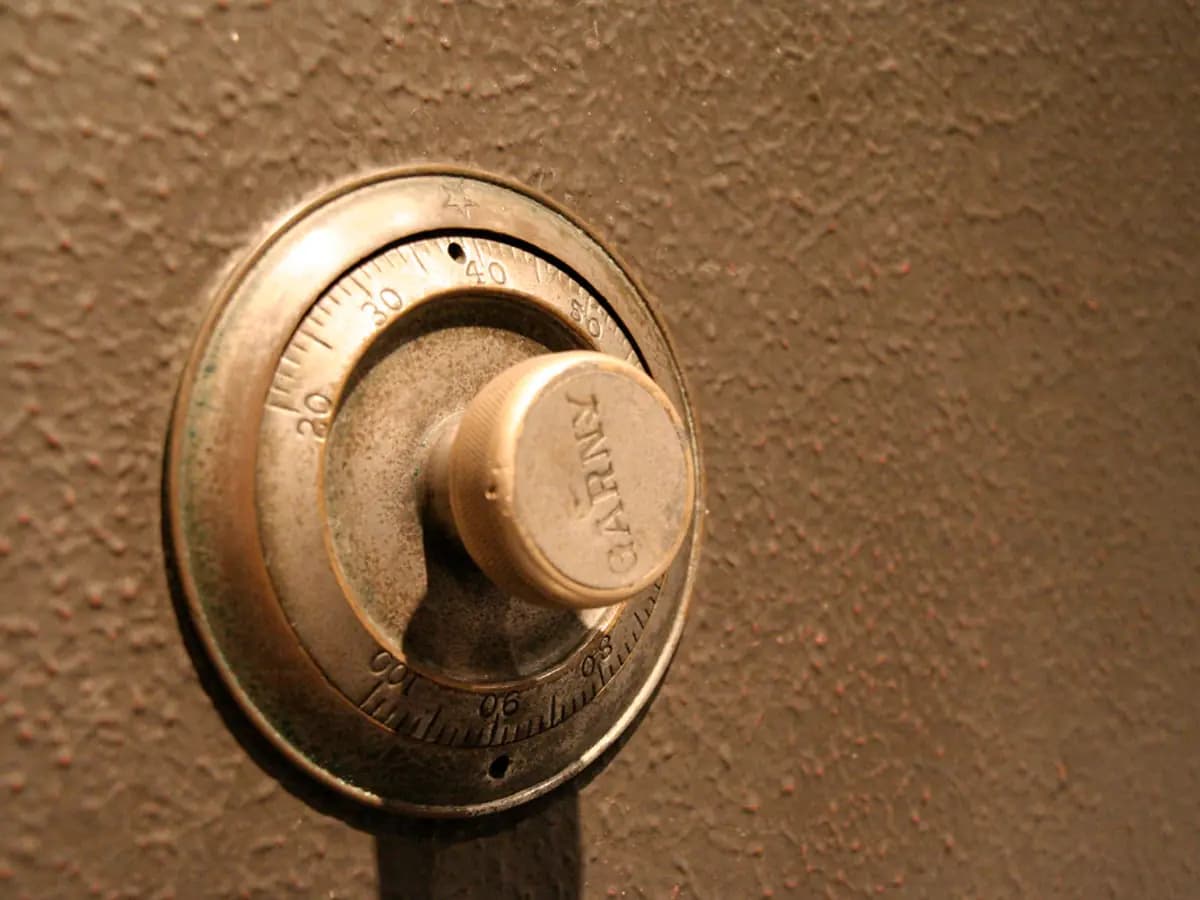 The brass combination dial of a strongroom door
