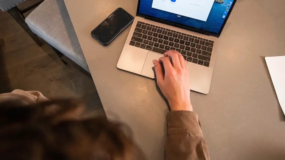 A candidate working at a laptop screen