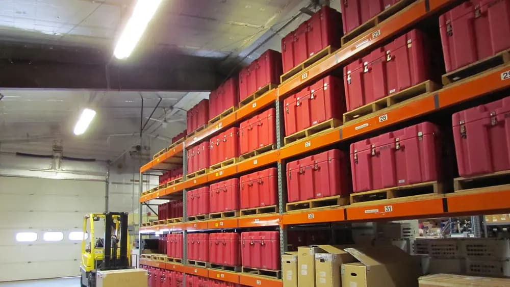 Stock stacked on the shelves of a store room