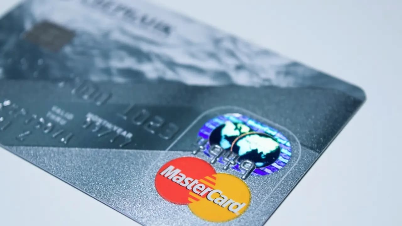 A bank card resting on a dark surface