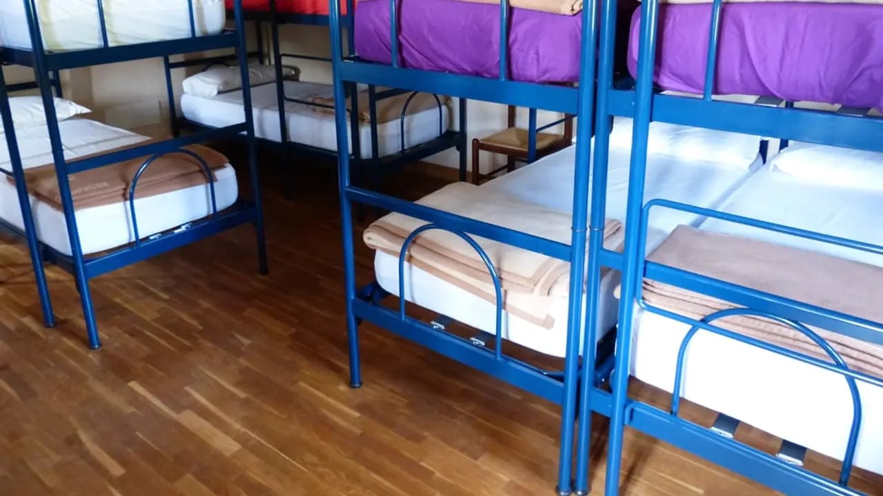 Bunk beds made up in a dormitory