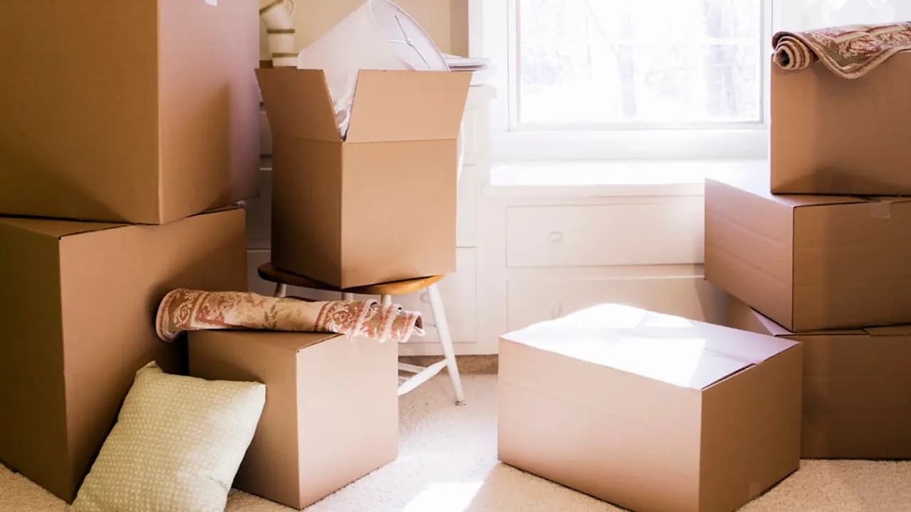 Packing boxes in an emptied room