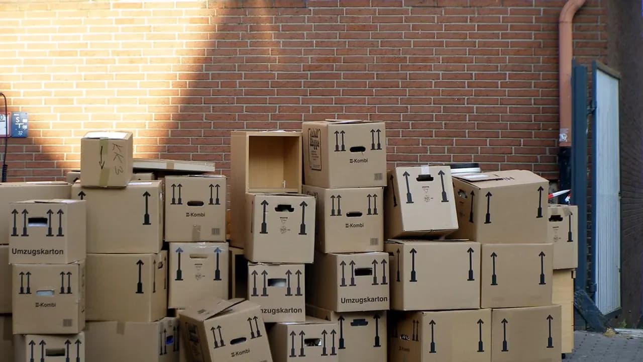 Removal boxes stacked against a wall