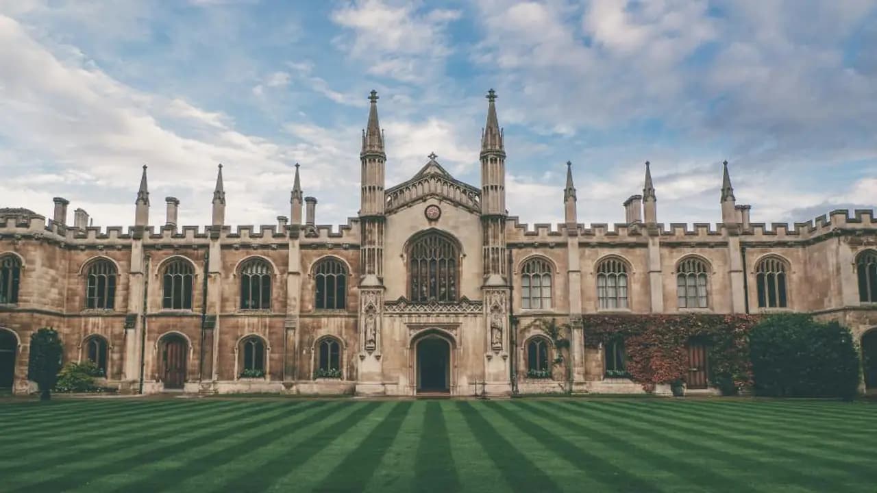 A large school campus behind its lawns
