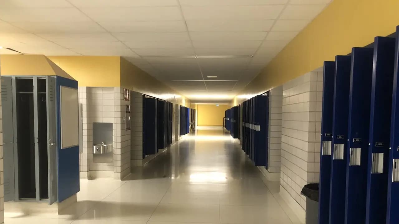 An empty school corridor lined with lockers